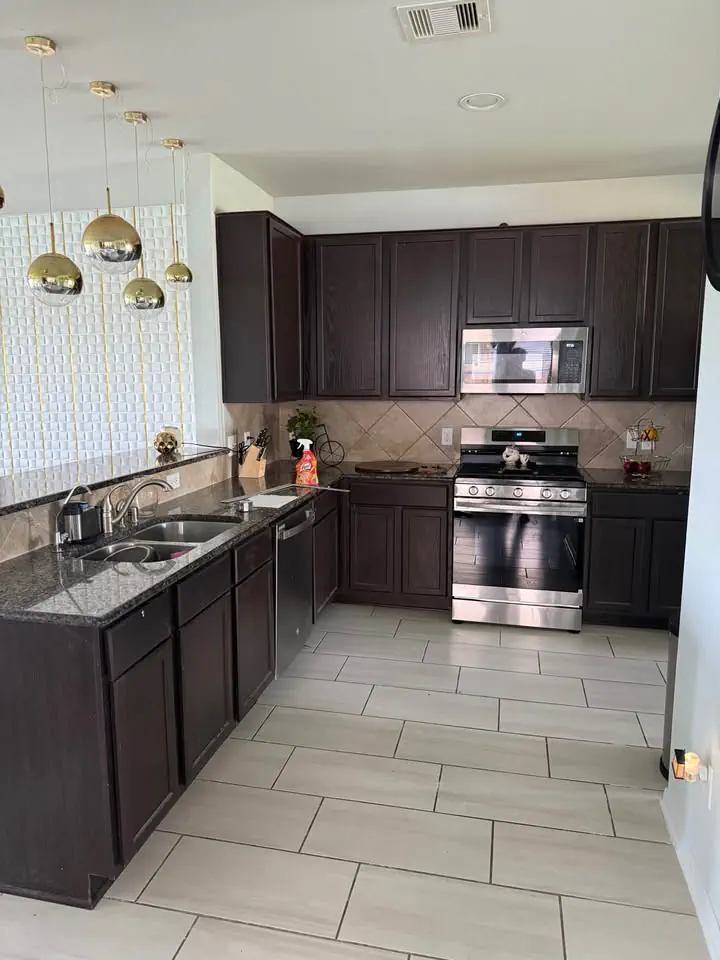 Kitchen before remodel — outdated cabinets and countertops, Lee County
