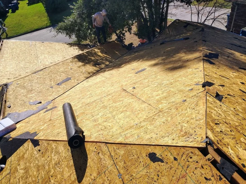 Roof before replacement — exposed deck, Lee County